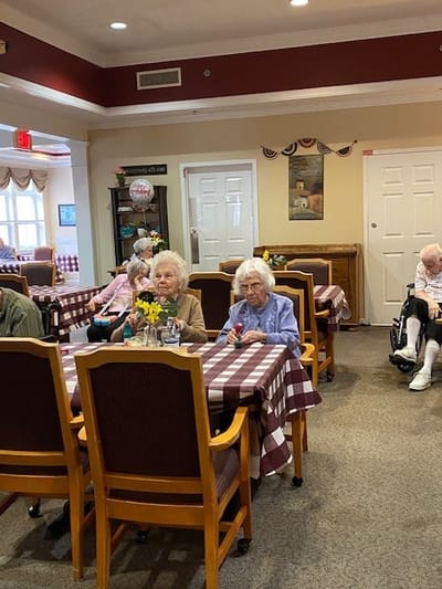 Residents enjoying a meal in the dining area.