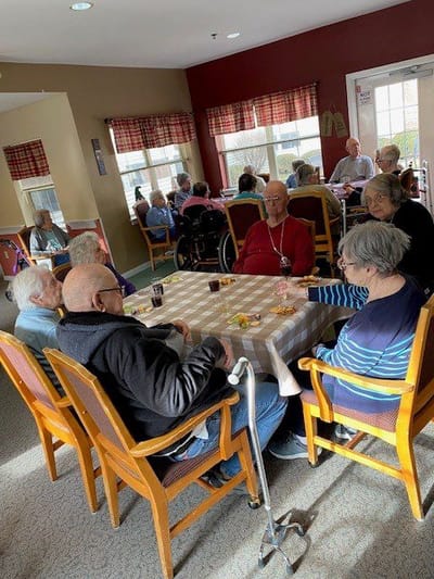 Residents socializing in a comfortable common area.