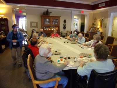 Residents engaged in a group crafting activity.