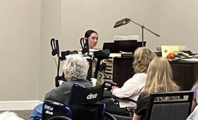 Residents enjoying a music performance activity.