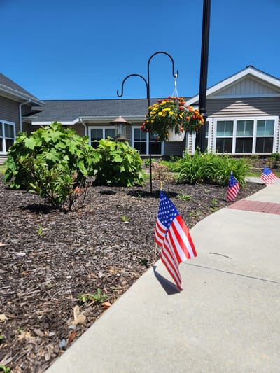 Garden area with flowers and American flags