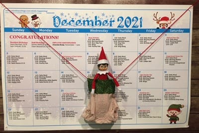 Calendar for December 2021 with holiday decorations.
