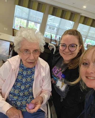 Residents and staff interacting in a common area