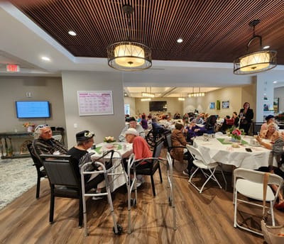 Residents enjoying a meal in the dining area.