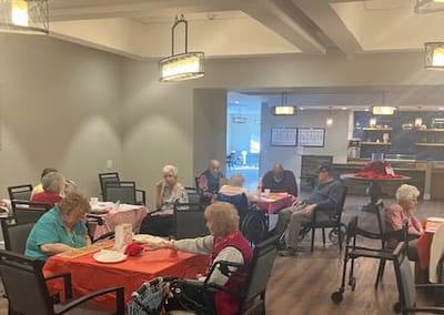 Dining area with residents engaged in activities