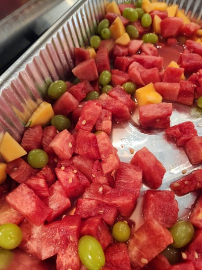 Fruit salad mix with watermelon, cantaloupe, and grapes.