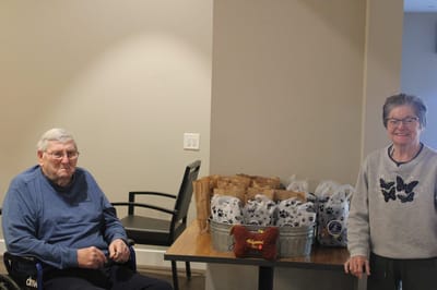 Two residents enjoying a communal activity.