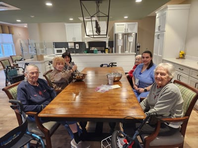 Residents socializing at a dining table