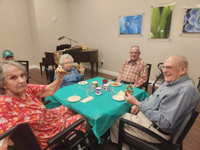 Residents enjoying snacks and activities indoors