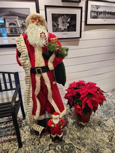 Decorative Christmas display with Santa and poinsettias