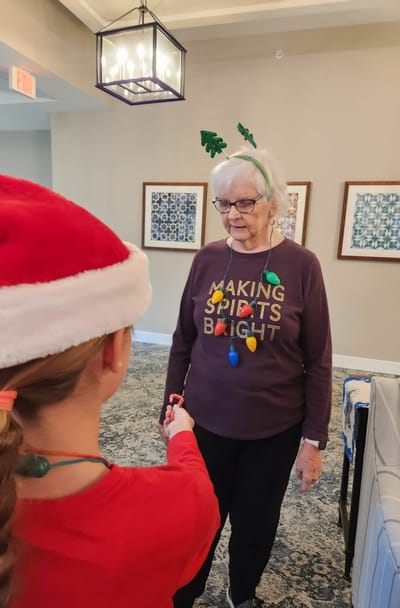 Residents celebrating with festive attire in a common area.