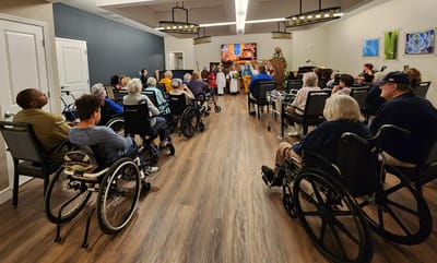 Residents attending an activity event in a common area.