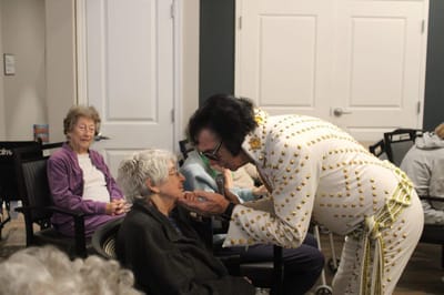 Residents enjoying a performance in a common area