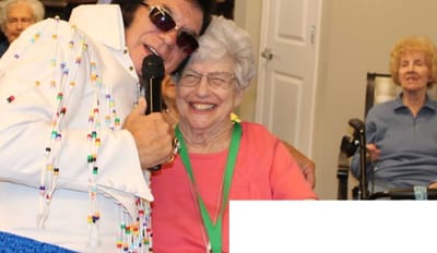 Resident enjoying performance with entertainer at event