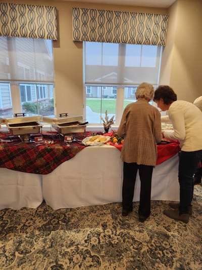Residents enjoying a meal at a buffet