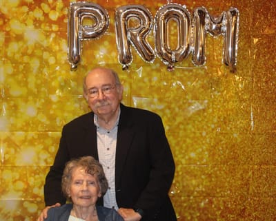 Older couple posing at a prom event