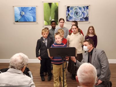 Children performing in a facility common area