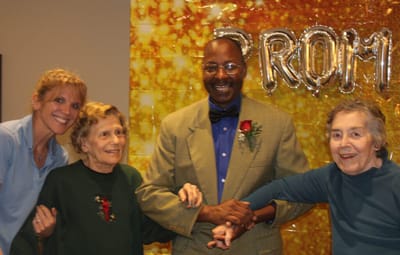 Residents enjoying an event with staff.