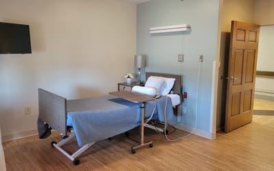 Private resident room with a hospital bed