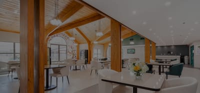 Bright common area with tables and chairs