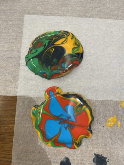 Colorful marbled paint blobs on paper