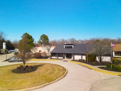 Exterior view of the facility with a circular driveway.