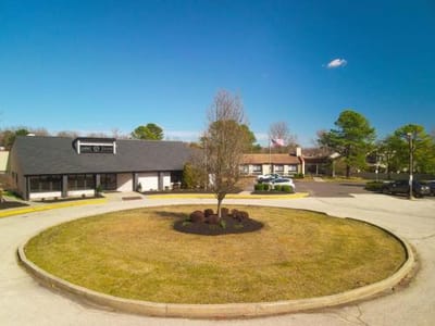 Aerial view of the front entrance and grounds.