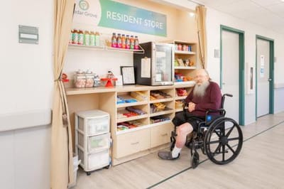 Resident using the store area with snacks and beverages.