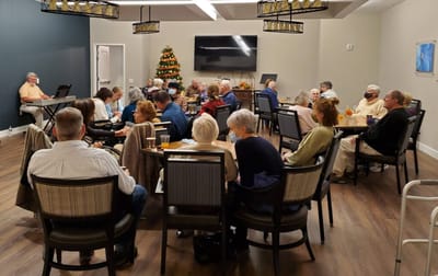 Residents enjoying a social gathering in a common area