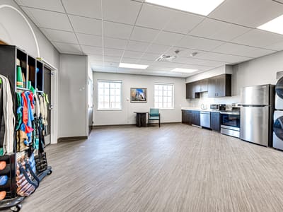 Bright common area with kitchen appliances.