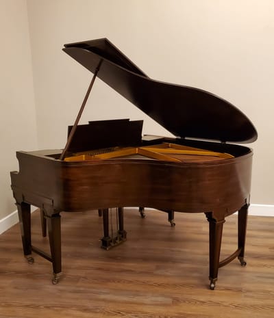 Grand piano in a facility's interior space.