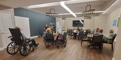 Residents enjoying live music in a common area