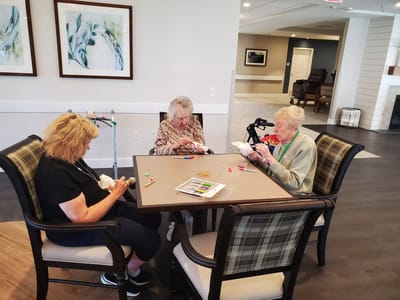 Residents engaged in a creative activity together.