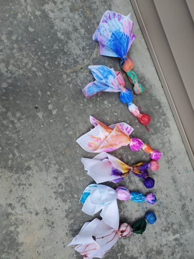 Colorful fabric decorations on a surface