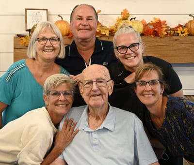 Group of residents and staff celebrating together