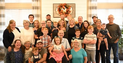 Group photo of residents and families in a common area