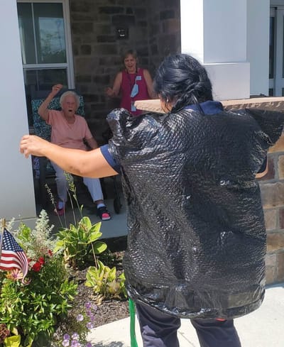 Residents engaged in a joyful outdoor activity.