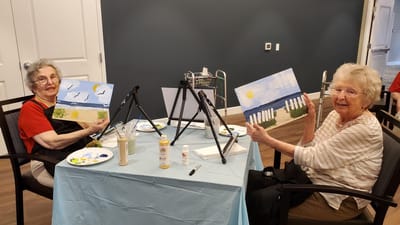 Residents painting during an activity session.