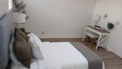 Neatly arranged private resident bedroom with simple decor
