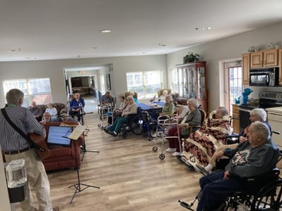 Residents enjoying music in a common area