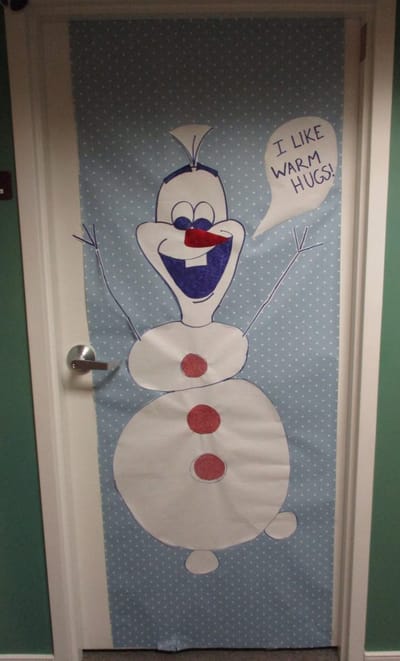 Door decorated with a snowman character.