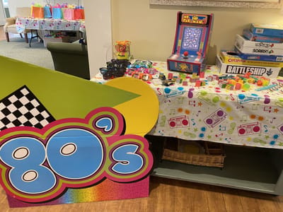 Colorful 80's themed decorations and games.