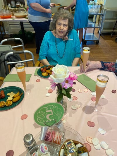 Senior woman enjoying a celebratory meal.