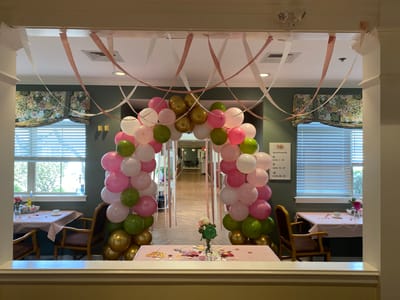 Colorful balloon arch in a decorated room