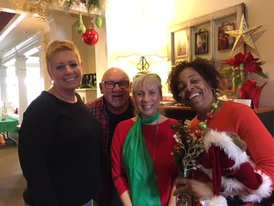 Staff members celebrating in a decorated common area.