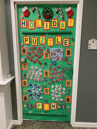 Decorative holiday-themed puzzle fun door display