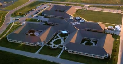Aerial view of the facility buildings and grounds.