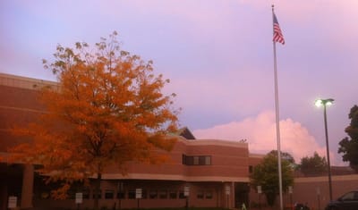 Exterior view of the nursing home with an autumn tree.