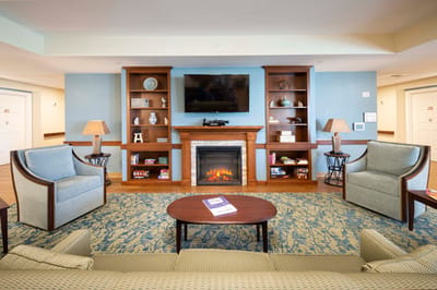 Comfortable common area with seating and fireplace