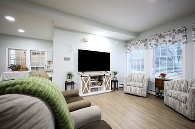 Cozy common area with comfortable seating and large windows